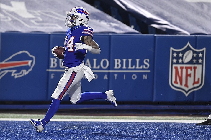 Buffalo Bills' Taron Johnson (24) returns an interception for a touchdown during the second half of an NFL divisional round football game against the Baltimore Ravens Saturday, Jan. 16, 2021, in Orchard Park, N.Y. (Adrian Kraus/AP)