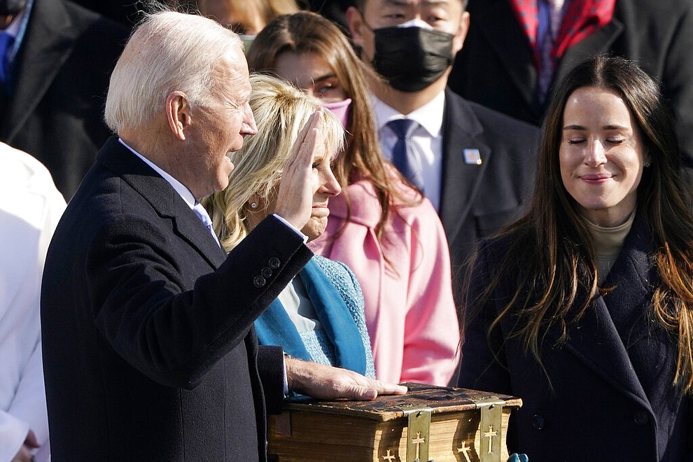 Joe Biden is sworn in as the 46th president of the United States by Chief Justice John Roberts as Jill Biden holds the Bible during the 59th Presidential Inauguration at the U.S. Capitol in Washington, Wednesday, Jan. 20, 2021.(AP Photo/Patrick Semansky, Pool)