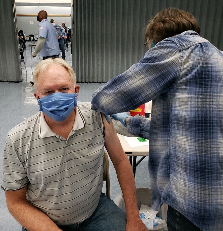 Prescott High School history and geography teacher Kelly Cordes receives his COVID-19 vaccination from PHS RN Carolyn Ernst on Friday, Jan. 22, 2021, in Prescott. (PUSD/Courtesy)