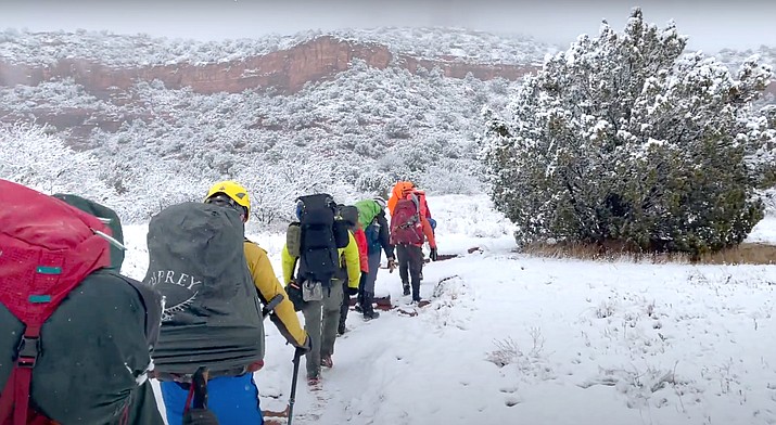 As search and rescue ground teams hiked for two days through extremely rough terrain and 18 or more inches of snow Tuesday, weather conditions prevented several attempts by aircrews to rescue the stranded hikers. (YCSO image from video)