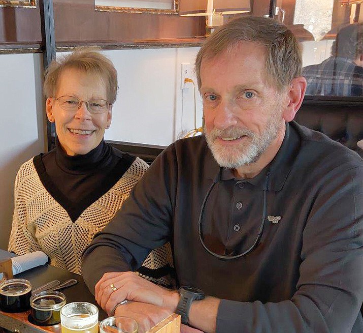 Eloise and Rick Baldauf with a flight of Belfry brew. Photo by The Dunnery