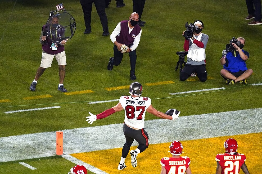 Tampa Bay Buccaneers' Rob Gronkowski (87) reacts after scoring a touchdown during the first half of the NFL Super Bowl 55 football game against the Kansas City Chiefs, Sunday, Feb. 7, 2021, in Tampa, Fla. (AP Photo/Charlie Riedel)