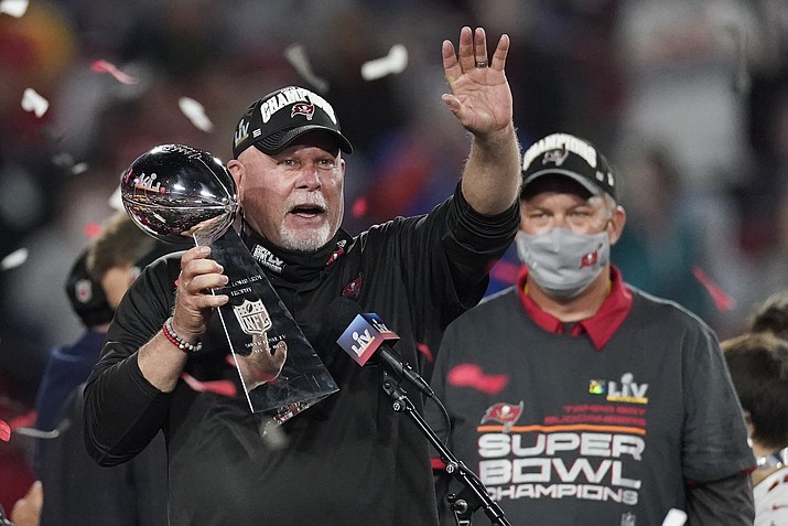 Tampa Bay Buccaneers head coach Bruce Arians holds up the Vince Lombardi trophy after defeating the Kansas City Chiefs in the NFL Super Bowl 55 football game Sunday, Feb. 7, 2021, in Tampa, Fla. The Buccaneers defeated the Chiefs 31-9 to win the Super Bowl. (Ashley Landis/AP)