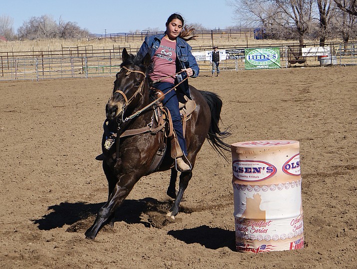 Rider Analee Mercado rounds the final barrel on her horse Piranha during a peewee division barrel race at the February Jackpot, an equestrian event that was hosted by Olsen’s Grain on Saturday, Feb. 20, 2021, in Chino Valley. (Aaron Valdez/Review)