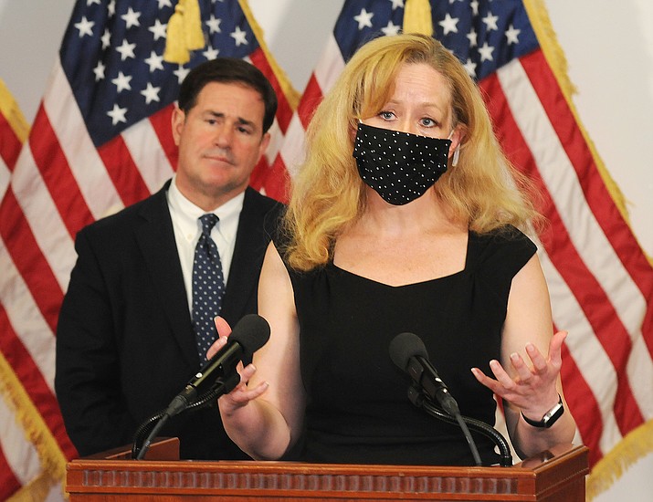 With Gov. Doug Ducey looking on, state Health Director Cara Christ at a press conference Sept. 24, 2020, in Phoenix. (Howard Fischer/Capitol Media Services, file)