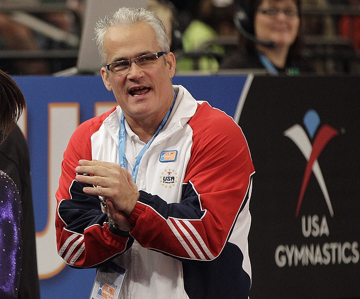 In this March 3, 2012, file photo, gymnastics coach John Geddert is seen at the American Cup gymnastics meet at Madison Square Garden in New York. Prosecutors in Michigan filed charges Thursday, Feb. 25, 2021, against Geddert, a former U.S. Olympics gymnastics coach with ties to disgraced sports doctor Larry Nassar. Geddert was head coach of the 2012 U.S. women's Olympic gymnastics team, which won a gold medal. (Kathy Willens, AP File)