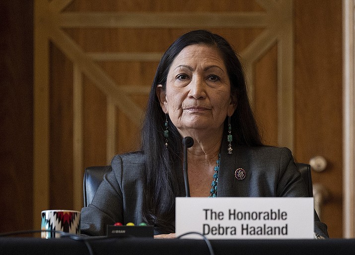 In this Tuesday, Feb. 23, 2021, file photo, Rep. Deb Haaland, D-N.M., listens during the Senate Committee on Energy and Natural Resources hearing on her nomination to be Interior secretary, on Capitol Hill in Washington. Some Republican senators labeled Haaland "radical" over her calls to reduce dependence on fossil fuels and address climate change, and said that could hurt rural America and major oil and gas-producing states. The label of Haaland as a "radical" by Republican lawmakers is getting pushback from Native Americans. (Jim Watson/Pool Photo via AP, File)