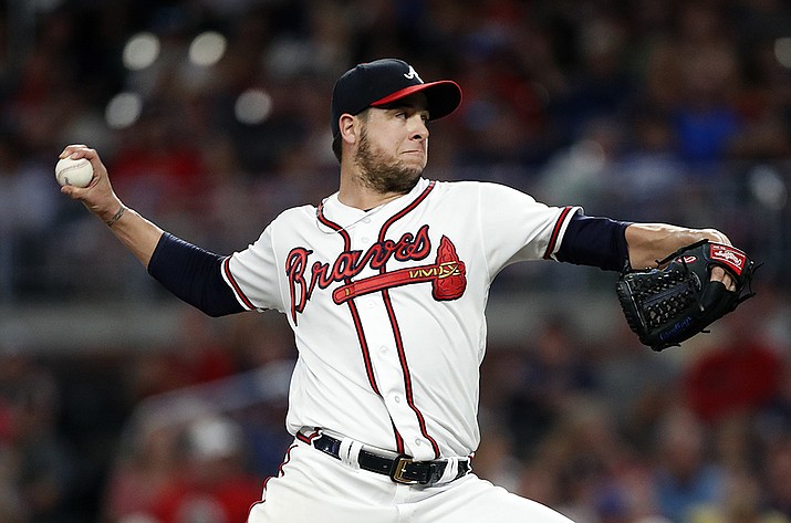 Atlanta Braves relief pitcher Anthony Swarzak works in the seventh inning of a baseball game against the New York Mets in Atlanta, in this Wednesday, June 19, 2019, file photo. The Arizona Diamondbacks have added veteran reliever Anthony Swarzak as a non-roster invitee to spring training. The team announced it added the 35-year-old right-hander on Thursday, March 4, 2021. (John Bazemore, AP File)