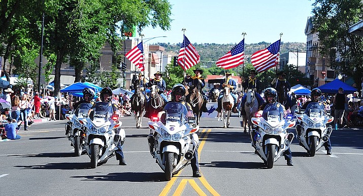 A Prescott Police motorcycle escort opens the Prescott Frontier Days Rodeo Parade through the streets of downtown Prescott in July 2019. (Courier file photo)