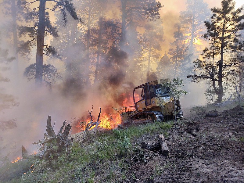A dozer creates a containment line on the 2020 Mangum Fire.