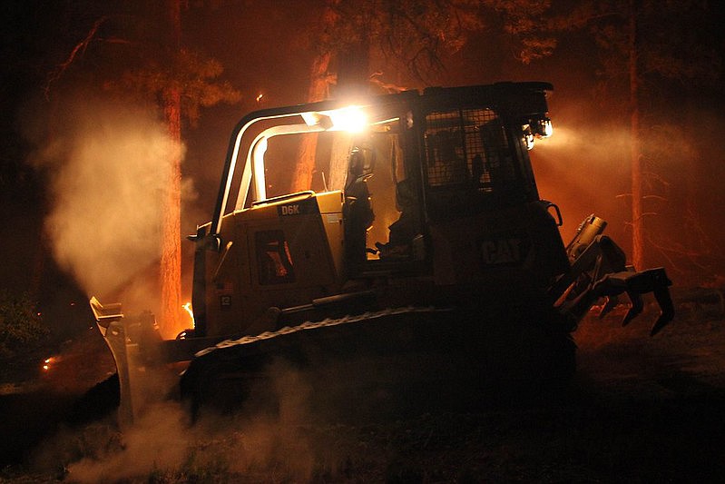 A dozer operator works through the night on the 2020 Mangum Fire.