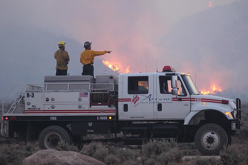 Firefighters from Arrow Fire and Land Management of Prescott work the 2020 Mangum Fire.