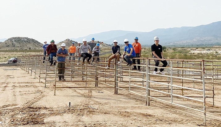 Valley Academy construction technology students take a break after building horse stalls at the Camp Verde Equestrian Center. Courtesy photo