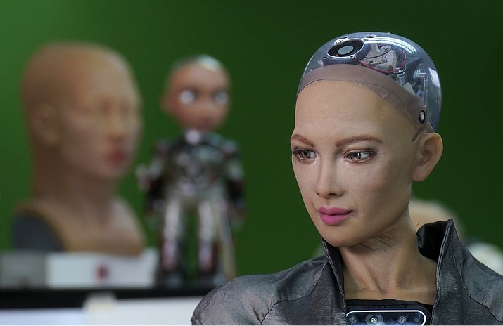 The close-up of the head of Sophia is seen at Hanson Robotics studio in Hong Kong on March 29, 2021. Sophia is a robot of many talents, she speaks, jokes, sings and even makes art. In March, she caused a stir in the art world when a digital work she created as part of a collaboration was sold at an auction for $688,888 in the form of a non-fungible token (NFT). (AP Photo/Vincent Yu)