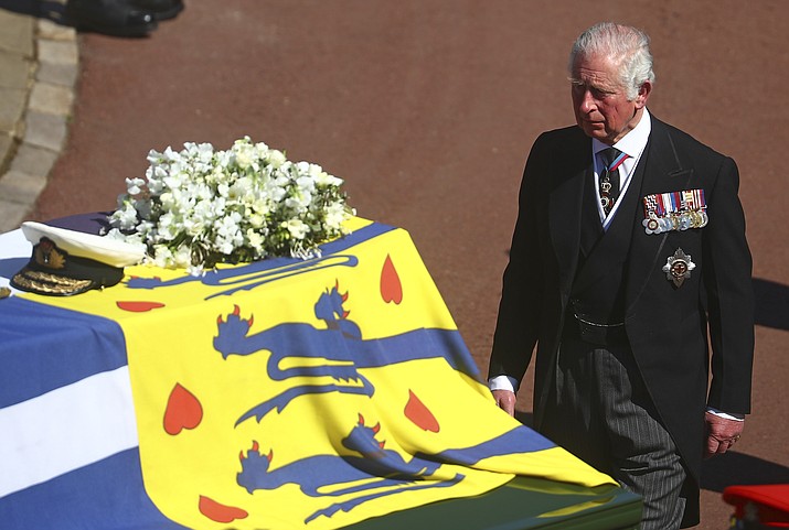 Prince Charles follows the coffin of his father Britain’s Prince Philip during the funeral inside Windsor Castle in Windsor, England, Saturday, April 17, 2021. Prince Philip died April 9 at the age of 99 after 73 years of marriage to Britain’s Queen Elizabeth II. (Hannah McKay/Pool via AP)