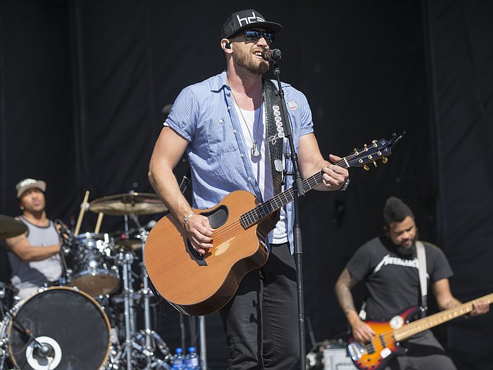 Chase Rice performs with his band at the 4th Annual ACM Party for a Cause Festival at the Las Vegas Festival Grounds in L:as Vegas, in this Sunday, April 3, 2016, file photo. Like many young football players growing up in North Carolina, Chase Rice had his sights set on the NFL. (Photo by Eric Jamison/Invision/AP, File)