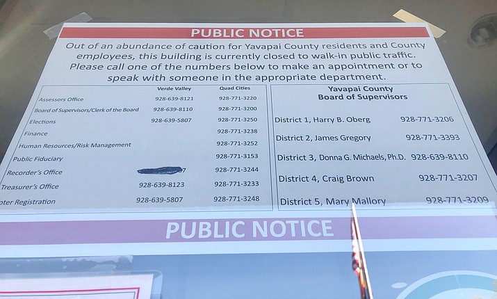 A public notice sign was posted outside the Yavapai County Administration Building in Prescott on Monday, April 19, 2021, that reads, “Out of an abundance of caution for Yavapai County residents and county employees, this building is currently closed to walk-in public traffic.” On Monday, administrators received a “threat” from a “former disgruntled employee,” and announced a five to 10-day closure of the building. (Cindy Barks/Courier)