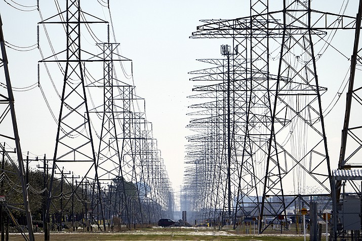 This Tuesday, Feb. 16, 2021 file photo shows power lines in Houston. The Biden administration is taking steps to protect the country’s electric system from cyberattacks through a new 100-day initiative combining federal government agencies and private industry. The initiative was announced Tuesday by the Energy Department. (David J. Phillip/AP)