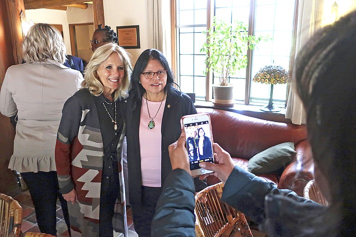 Jill Biden, left, and Tuba City Regional Health Care Corp. CEO Lynette Bonar pose for photos after an event in Flagstaff, Arizona. Biden is traveling to the country's largest Native American reservation, the Navajo Nation, which was hit hard by the coronavirus but is outpacing the U.S. in vaccination rates while maintaining strict pandemic restrictions. The trip, scheduled for April 22-23, 2021, will be Biden's third to the reservation that spans 27,000 square miles in the Four Corners region, and her inaugural visit as first lady. (AP Photo/Felicia Fonseca, File)