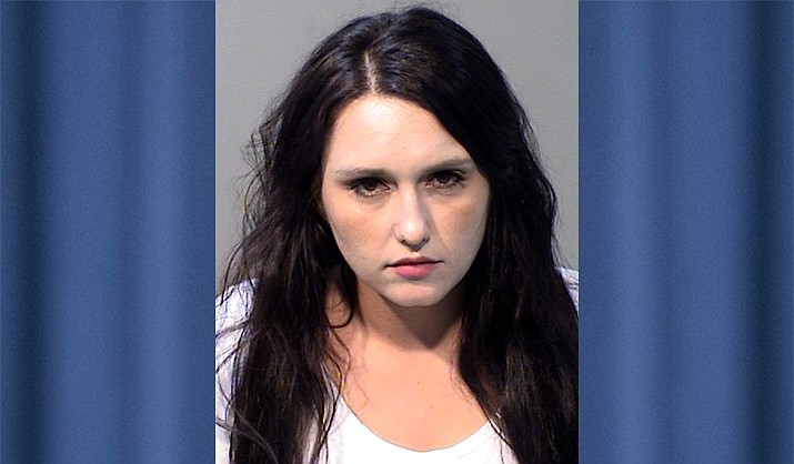 Holly Zinkl, 34, of Prescott Valley, was arrested and charged with possession of dangerous drugs, drug paraphernalia and false reporting on law enforcement. (PVPD/Courtesy)