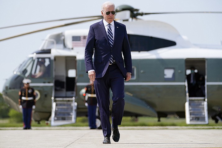 President Joe Biden walks to board Air Force One at Quonset Point Air National Guard in North Kingstown, R.I., Wednesday, May 19, 2021, to travel back to Washington after attending the commencement for the United States Coast Guard Academy in New London, Conn. (AP Photo/Andrew Harnik/AP)