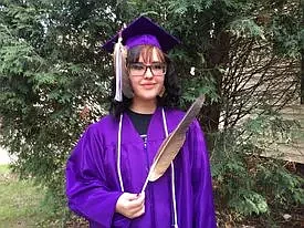Maya Fairbanks in her cap and eagle feather she is wearing for graduation at Cloquet High School. (Photo courtesy of Sheila Lamb via Indian Country Today)