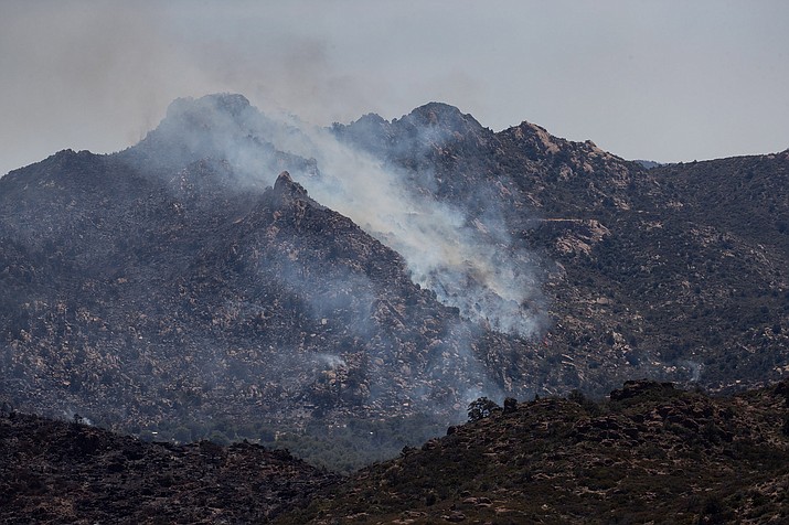 The Telegraph Fire burns Thursday, June 10, 2021 in Globe, Ariz. Gov. Doug Ducey has called a special session of the Legislature to boost wildfire funding as two large wildfires burn in south-central Arizona. (Mark Henle, Pool via AP)