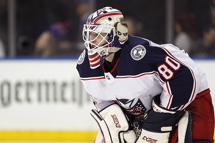 A medical examiner in Michigan says an autopsy has determined that Columbus Blue Jackets goaltender Matiss Kivlenieks, shown here in 2020, died of chest trauma from an errant fireworks mortar blast Sunday, July 4, 2021.(Kathy Willens, AP File)