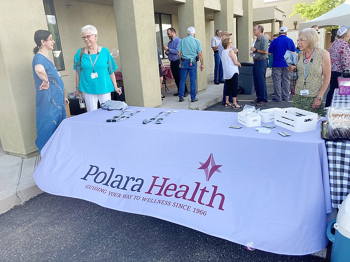 Guests celebrate the unveiling of the Polara Health logo rebrand at the finale party Tuesday, June 29, 2021. (Nanci Hutson/Courier)