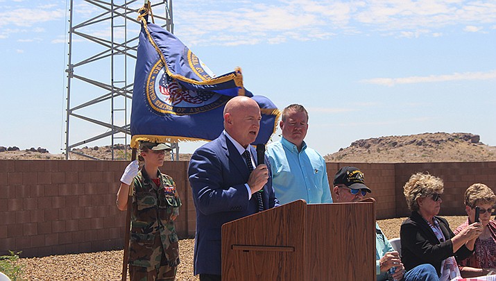 U.S. Sen. Mark Kelly (D-Arizona) toured the Kingman Airport and Industrial Park and talked to local leaders about infrastructure during his visit to Kingman on Wednesday, July 7. Kelly is shown later in the day talking to the crowd at the dedication of the Kingman Veteran Villas on Wednesday, July 7. (Photo by Travis Rains/Kingman Miner)