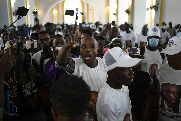 A man yells for justice during a memorial service for assassinated Haitian President Jovenel Moïse in the Cathedral of Cap-Haitien, Haiti, Thursday, July 22, 2021. Moïse was killed in his home on July 7. (Matias Delacroix/AP)