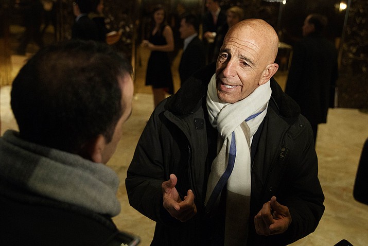 This photo from Tuesday Jan. 10, 2017, shows Tom Barrack peaking with reporters in the lobby of Trump Tower in New York before meeting with President-elect Donald Trump. Barrack, chair of former President Donald Trump's 2017 inaugural committee, was arrested Tuesday, July 20, 2021, in California on charges alleging that he and others conspired to influence Trump's foreign policy positions to benefit the United Arab Emirates. (Evan Vucci/AP, File)