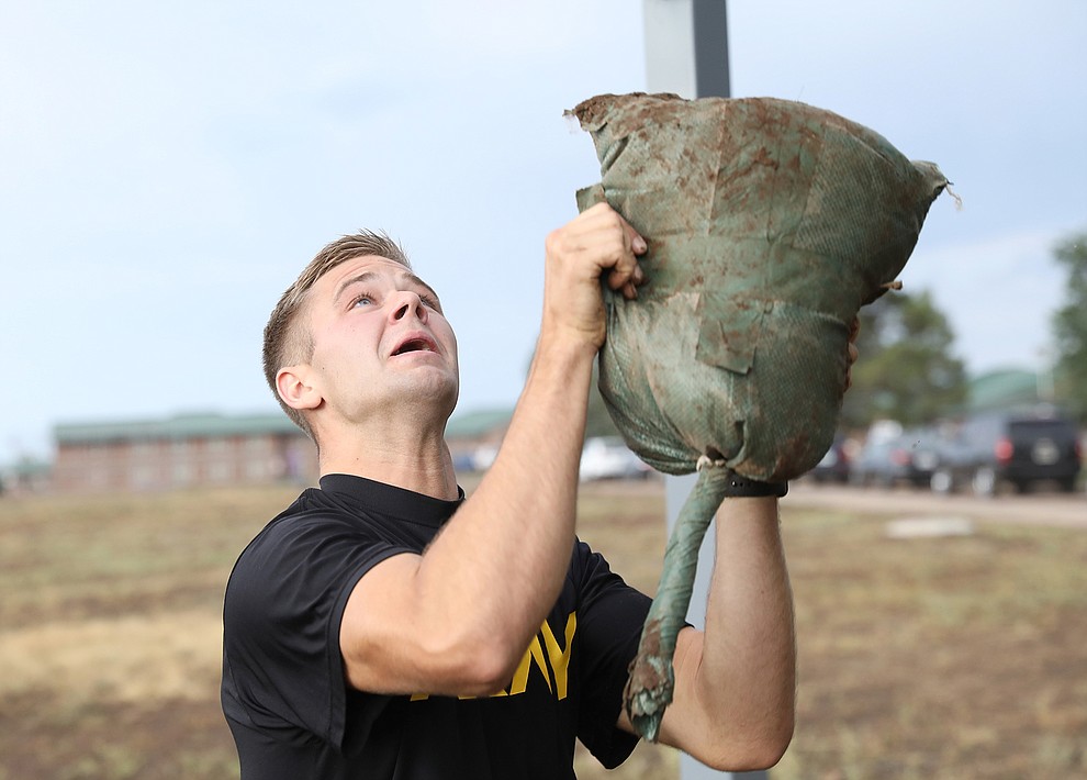 Sgt. William Lukens, with 208th Medical Company Area Support, Tennessee National Guard, throws a sandbag over a pull up bar during the physical fitness assessment of the 2021 Army National Guard Best Warrior Competition at Camp Navajo, Arizona, July 20, 2021. The competition spans three physically and mentally demanding days where competitors are.tested on a variety of tactical and technical skills as they vie to be named the Army Guard’s.Soldier and Noncommissioned Officer of the Year. The winners then represent the Army.Guard in the Department of the Army Best Warrior Competition later this year.The competition spans three physically and mentally demanding days where competitors are.tested on a variety of tactical and technical skills as they vie to be named the Army Guard’s.Soldier and Noncommissioned Officer of the Year. The winners then represent the Army.Guard in the Department of the Army Best Warrior Competition later this year.