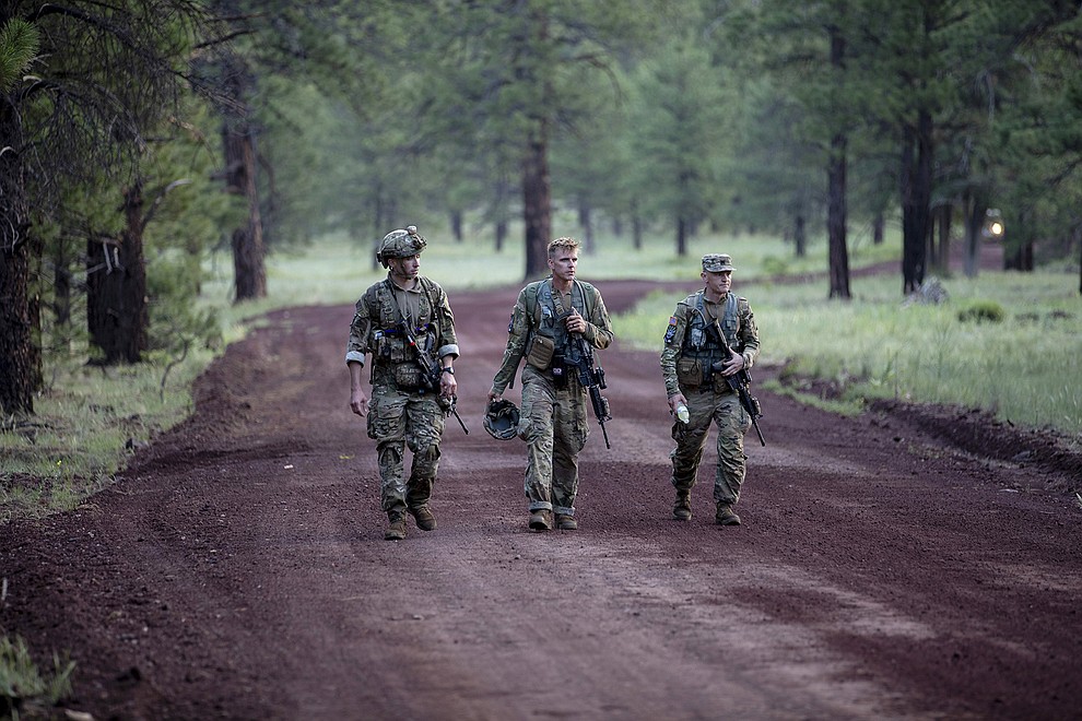 Competitors walk from the land navigation course to the situational training exercise lanes during the 2021 Army National Guard Best Warrior Competition at Camp Navajo Military Reservation, Arizona, July 21, 2021. The competition spans three physically and mentally demanding days where competitors are tested on a variety of tactical and technical skills as they vie to be named the Army Guard’s Soldier and Noncommissioned Officer of the Year. The winners then represent the Army Guard in the Department of the Army Best Warrior Competition later this year (US Army photo by Sgt. Laura Bauer).