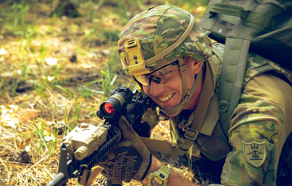 Staff Sgt. Brandon T. Wendland, with 957th Engineer Company MRBC, Minnesota Army National Guard, smiles as he pulls security during the Mystery Event at the 2021 Army National Guard Best Warrior Competition at Camp Navajo, Arizona, July 22, 2021. The competition spans three physically and mentally demanding days where competitors are tested on a variety of tactical and technical skills as they vie to be named the Army Guard’s Soldier and Noncommissioned Officer of the Year. The winners then represent the Army Guard in the Department of the Army Best Warrior Competition later this year (US Army photo by Spc. Carlos Parra).