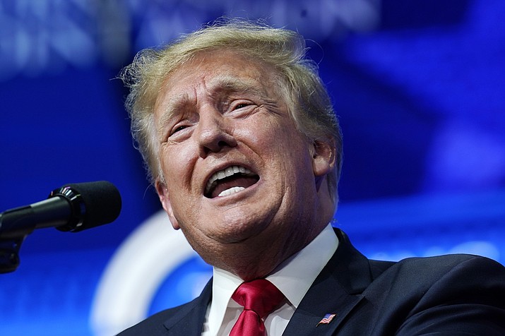 In this July 24, 2021, file photo former President Donald Trump speaks on a variety of topics to supporters at a Turning Point Action gathering in Phoenix. Groups linked to Trump and conspiracy theories about the 2020 election have put more than $5.6 million into the Arizona election audit. (Ross D. Franklin/AP, file)