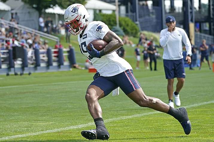 New England Patriots wide receiver N'Keal Harry (15) runs after catching a pass during an NFL football practice, Friday, July 30, 2021, in Foxborough, Mass. (Elise Amendola/AP)