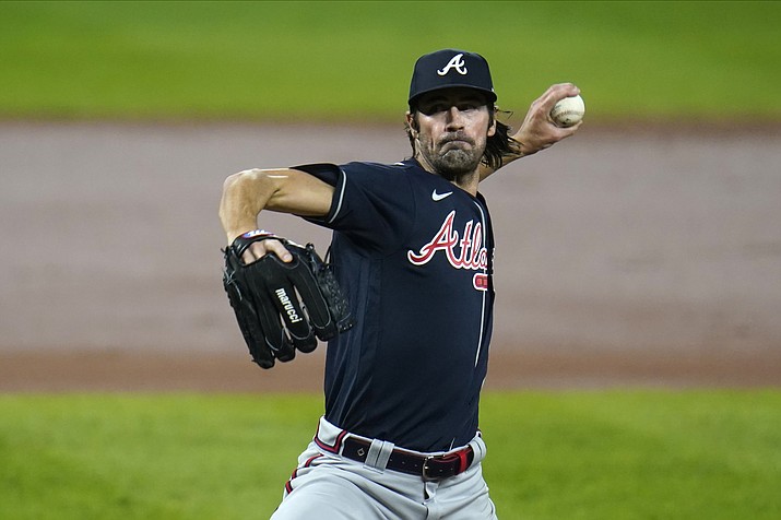 In this Wednesday, Sept. 16, 2020 photo, Atlanta Braves starting pitcher Cole Hamels throws a pitch to the Baltimore Orioles during the second inning of a game in Baltimore. (Julio Cortez/AP, File)