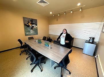 Tsé Bii’ Ndzisgaii Community Center Director, Shandiin Herrera, stands in the conference room of the new community center.  (Photo/Navajo and Hopi Families COVID-19 Relief)