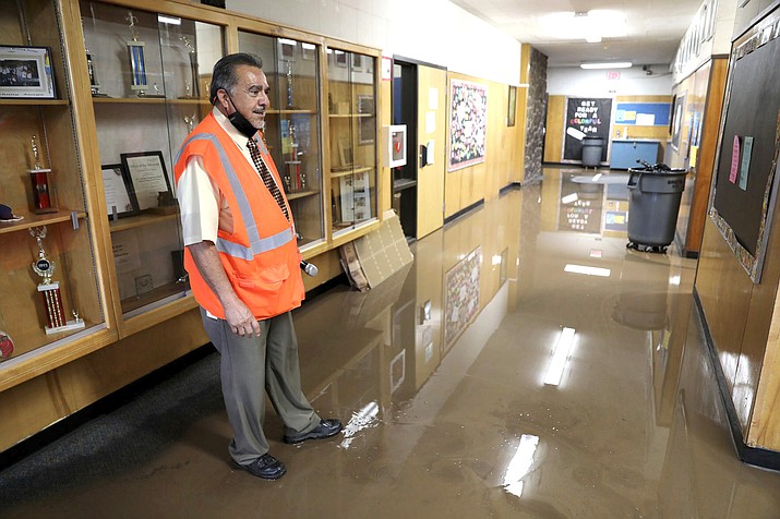 Killip Elementary School principal Joe Gutierrez looks over flooding Aug. 17 in Flagstaff. (Jake Bacon/Arizona Daily Sun via AP)