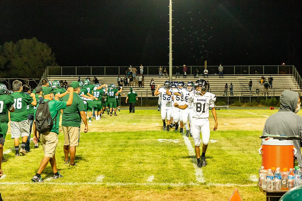 Because of COVID-19 concerns and guidelines, teams did not give the celebratory hand slap at the end of the Aug. 27 game against Whitehorse High School Raiders. (Gilbert Honanie/NHO)