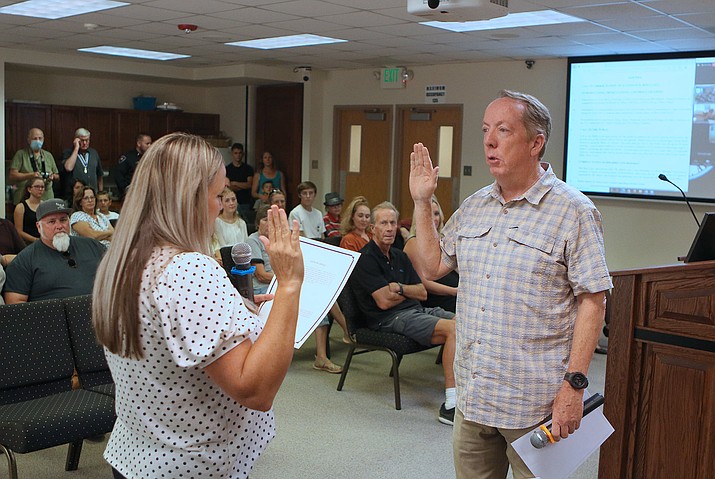 John McCafferty, right, is sworn in by Town Clerk Erin Deskins as the Chino Valley Town Council voted to appoint him to the vacant council seat during a meeting on Tuesday, Aug. 24, 2021, at Chino Valley Town Hall. (Town of Chino Valley/Courtesy)