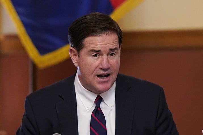 In this 2020 file photo, Gov. Doug Ducey speaks at the Arizona Capitol in Phoenix. Ducey said Tuesday, Aug. 31, 2021, he's not interested in revisiting the ban on mask mandates despite new data showing schools that don't require face coverings are twice as likely to have an outbreak of COVID as those who have defied his edict. (Ross D. Franklin/AP, file)