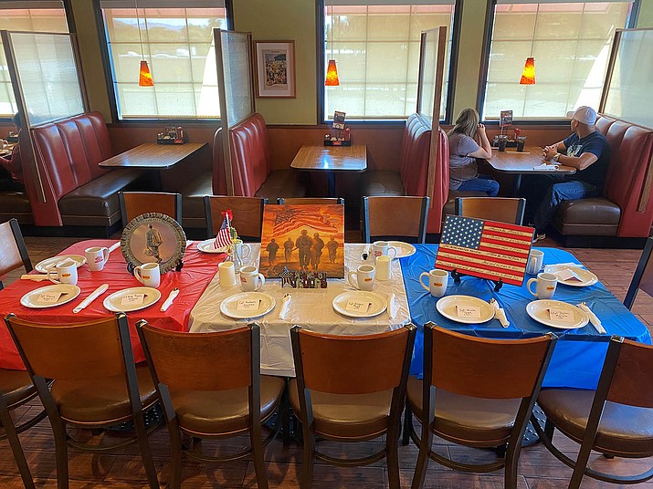 In effort to honor the 13 U.S. soldiers killed during a suicide bombing in Afghanistan on Aug. 26, 2021, the Denny’s in Cottonwood, 2211 State Route 89A, set up a table with a plate for each soldier Thursday, Sept. 2. Denny’s General Manager Christine Hansen says she plans to keep it set up until Saturday, Sept. 11, the 20th anniversary of 9-11. (Ashleigh Clark/Courtesy)