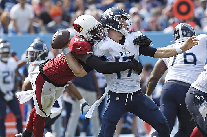 Arizona Cardinals linebacker Chandler Jones (55) sacks Tennessee Titans quarterback Ryan Tannehill (17) and forces a fumble that the Cardinals recovered in the second half of an NFL football game Sunday, Sept. 12, 2021, in Nashville, Tenn. (Mark Zaleski/AP)