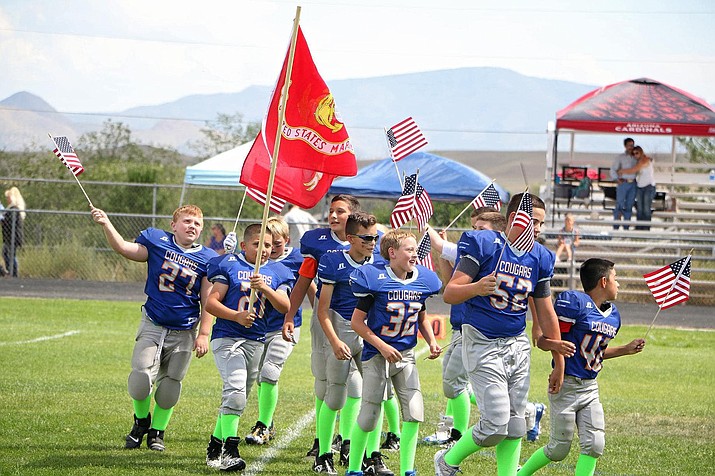 During their game day on Saturday, Sept. 11, 2021, at Chino Valley High School, the Chino Valley Youth Football and Cheer (CVYFC) teams participated in a ceremony to honor the victims and heroes of 9/11 while also showing support for Kevin Garcia, a local boy who was a player with the league and is currently battling a rare form of Non Hodgkins Lymphoma. See the brief below for fundraisers to benefit Kevin. (CVYFC/Courtesy photo)