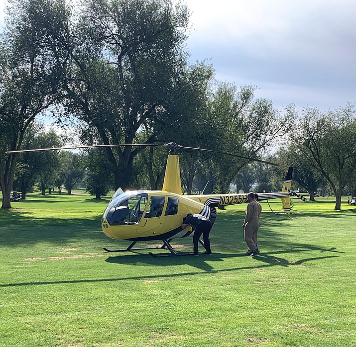 A Universal Helicopter R-44 made an emergency landing on a fairway at the Prescott Antelope Hills Golf Course Friday morning, Sept. 24, 2021, after experiencing engine difficulties. (Prescott Regional Airport/Courtesy)