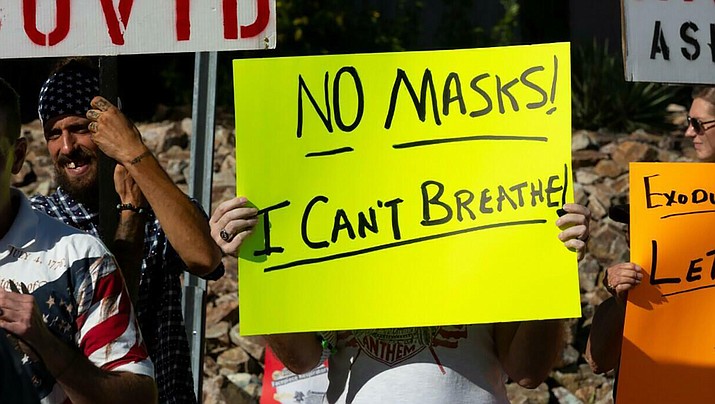 Protesters demonstrate in Tucson in opposition to the new mask mandate to prevent the spread of the coronavirus disease (COVID-19) in Tucson, Arizona, June 20, 2020. (Courier file photo)