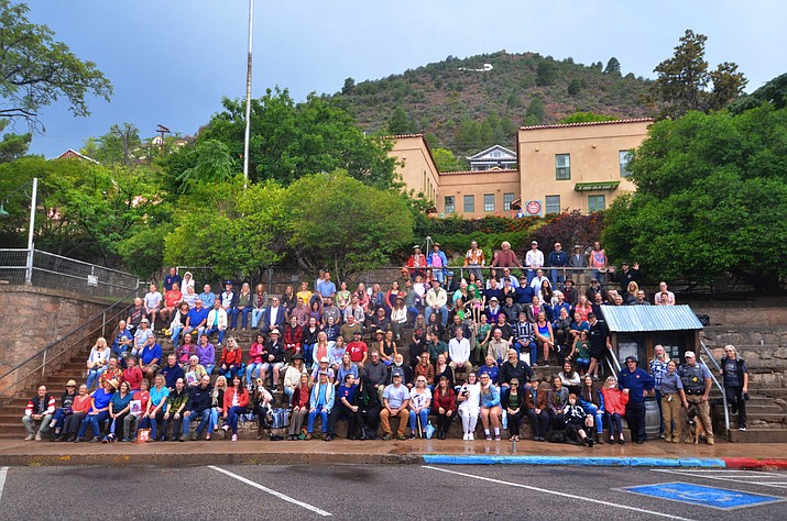 Clouds, rain and even some distant thunder didn’t keep Jerome residents from gathering for their town traditional town portrait Thursday, Sept, 30, 2021. Slowly people came with umbrellas and determination as raindrops fell on the famous Jerome steps where local photographer Michael Thompson would once again take their town portrait. He said the portrait is taken every few years. (Vyto Starinskas/Independent)