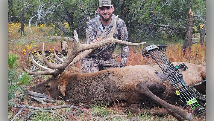 Daniel Del Monaco of Kingman displays the big elk he killed during an archery hunt this fall. (Courtesy photo)